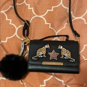 Mini crossbody bag with pom pom jeweled key chain.